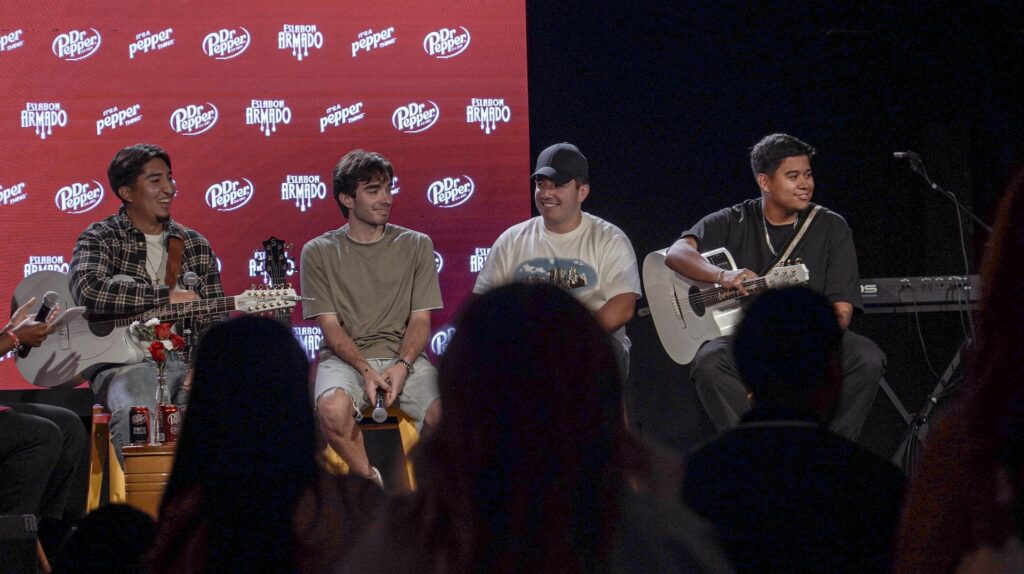 Performers on stage with audience